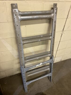 Used old‑style 10-foot Westeel galvanized grain bin ladder leaning against a wall