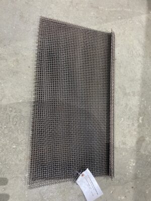 Woven steel bean screen for Lambton 1500 BPH grain cleaner laid flat on a concrete floor.