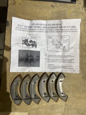 Shivvers bolt‑on inset wheel replacement kit with instruction sheet and six cast wheel segments on a wooden surface.