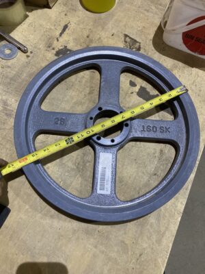 Top-down view of a 2B160SK cast-iron sheave pulley with a tape measure across its 16-inch diameter.