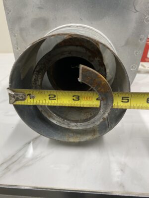 Front view of a RAD 5-inch flex auger unloader intake with a tape measure showing the internal opening diameter.
