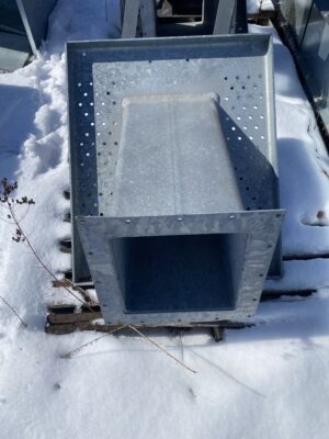 Front view of a Brock 12-inch side draw weldment showing the square outlet opening and angled discharge spout.