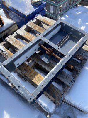 Norstar 12-inch slide gate with UHMW runners shown open on a wooden pallet outdoors.