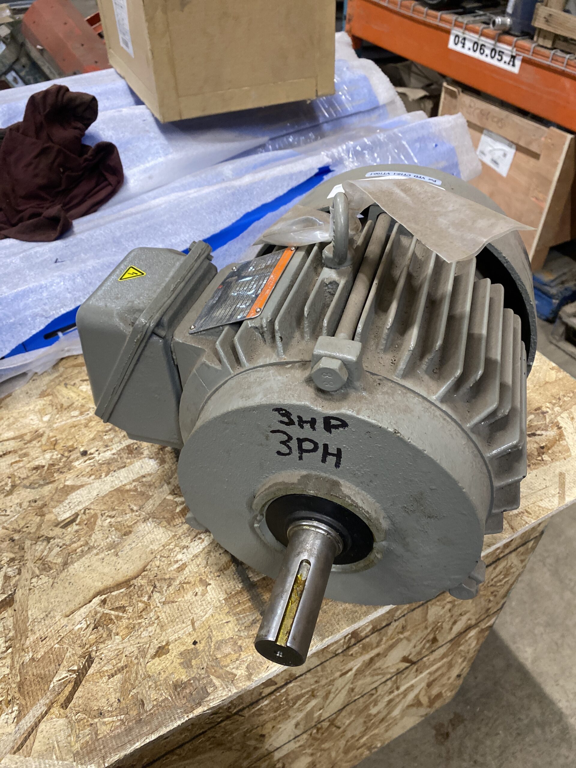 Front view of a Tatung 3 HP 575V motor showing the output shaft, front bearing housing, and junction box.