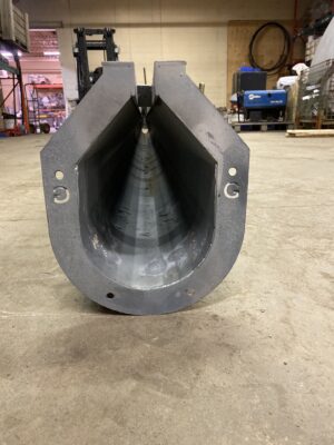 End view of a galvanized commercial U‑Drain showing the U‑shaped channel and flanged bolt holes.
